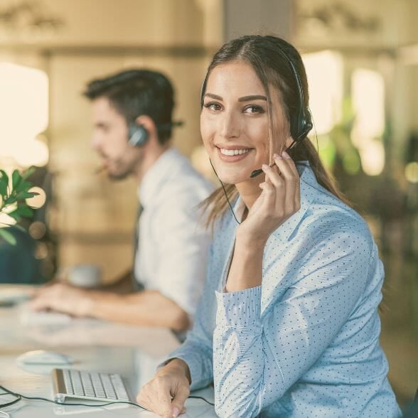 A woman with a headset, delivering 24/7 Support.