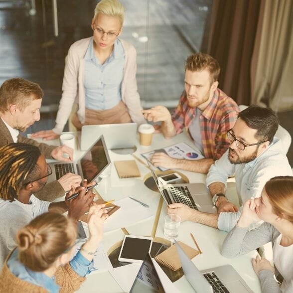 A group of people at a table enjoying a Training.